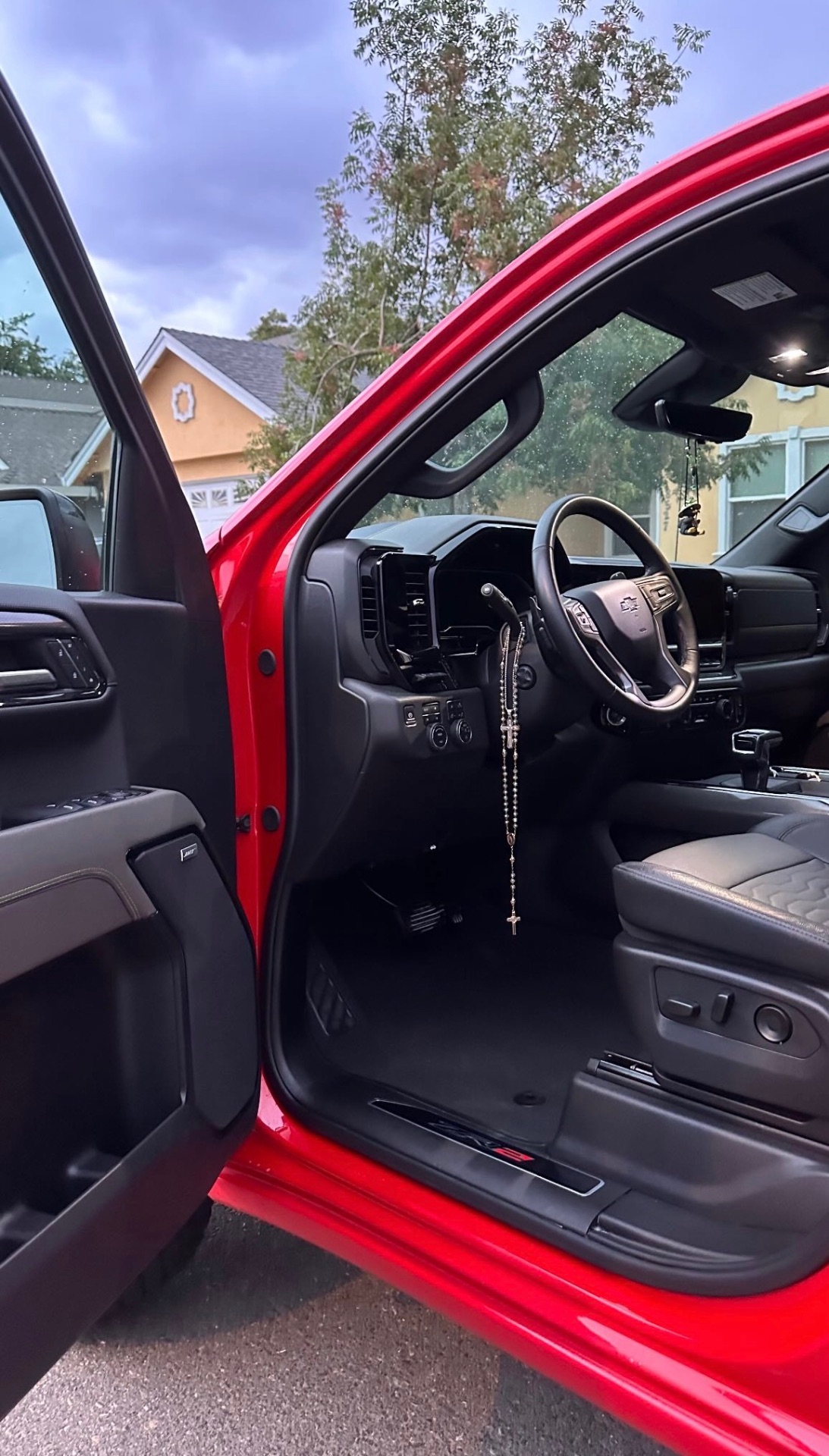 Cleaned black interior and dash of a red Silverado